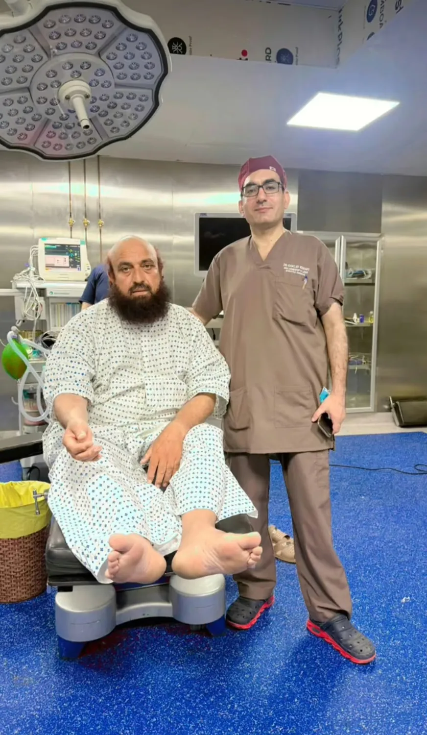 Dr. Ramzan with a patient in the operating room