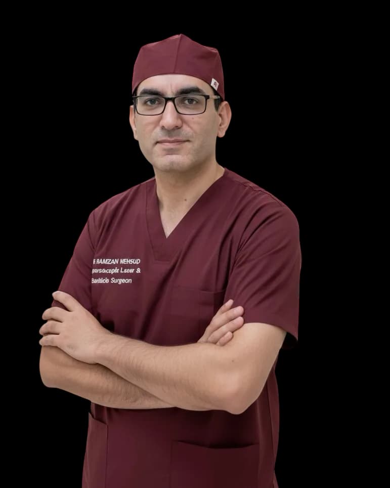 Dr. Ramzan Masood , surgeon, standing with arms crossed